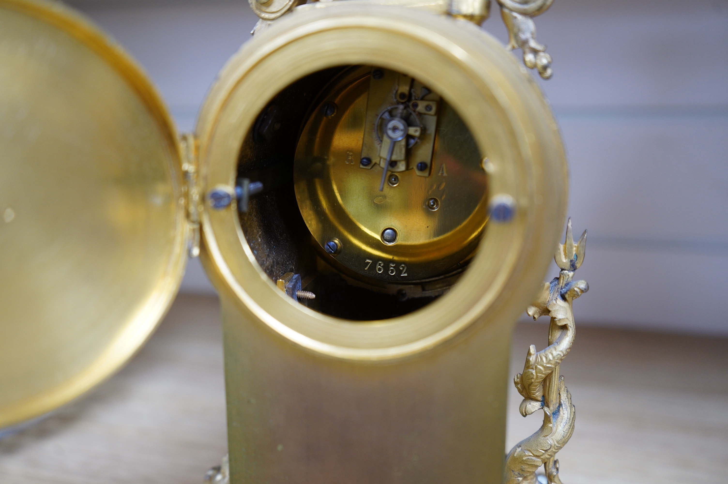 A French champleve mantle timepiece, with balance escapement, 27cm high. Condition - fair to good.